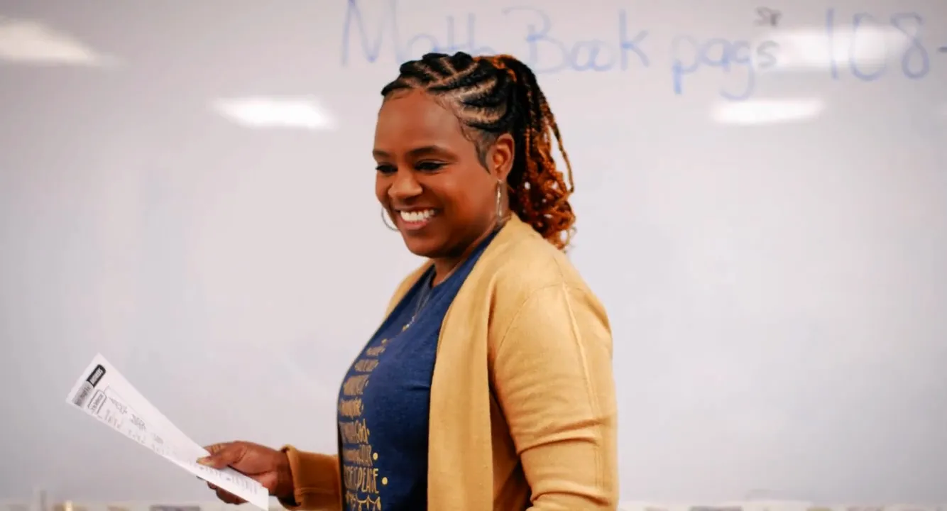 An FCC School teacher smiling at her class